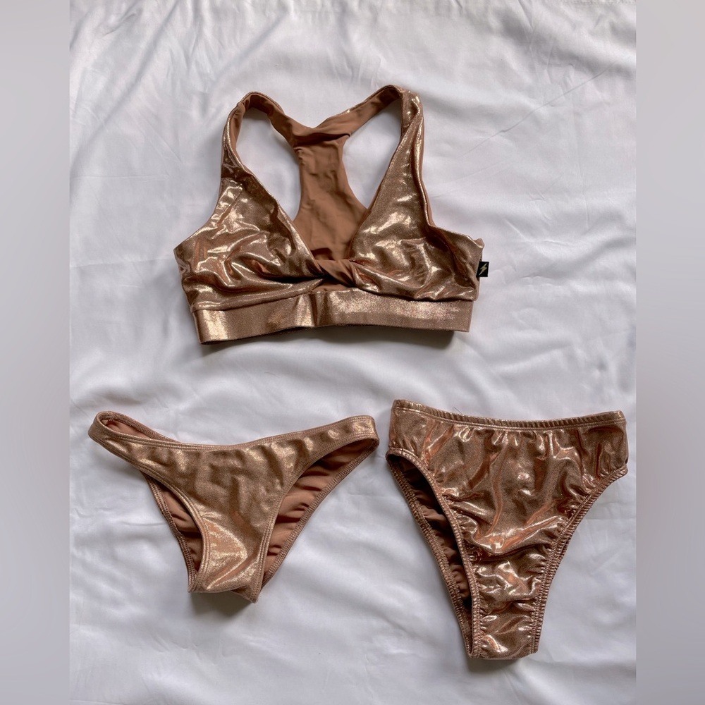 Cleo the Hurricane Polewear. Rose gold bra, high rise panty and scanty pants